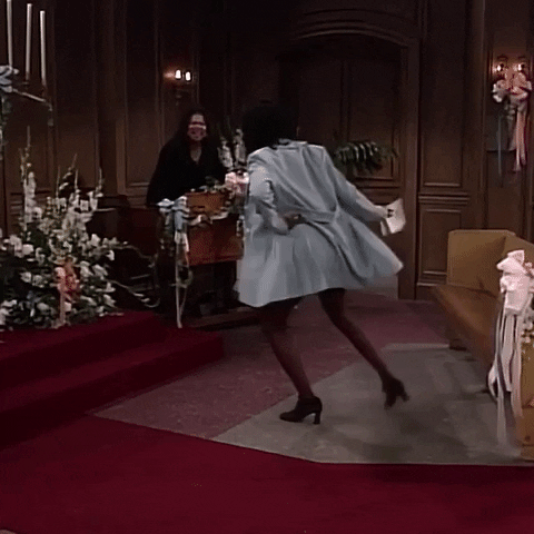 Maxine Shaw (portrayed by Erika Alexander) dancing in circles in a church while Khadijah James (portrayed by Queen Latifah) is hyping her up in the background.